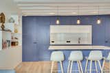 Kitchen, Pendant Lighting, Engineered Quartz Counter, Light Hardwood Floor, and Colorful Cabinet The kitchen doors  Photo 7 of 18 in La Grande Bleu by HOCH studio