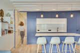 Kitchen, Light Hardwood Floor, Engineered Quartz Counter, and Colorful Cabinet The kitchen doors  Photo 6 of 18 in La Grande Bleu by HOCH studio