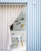 The pink curtain is made from a semi-transparent material, which is visually similar to linen. The client's children like to use it like a "theatre curtain" when playing.