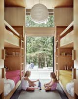 The home has a master bedroom and a bunk room with four beds. The clients' two daughters enjoy completely disconnecting from technology when spending time in the weekend retreat.