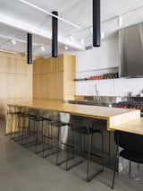 The kitchen is inspired by the commercial kitchens that the client worked at in his youth. 