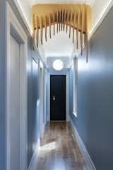 The Edwardian hallway arch had been removed from the original home, and the design team was determined to reinstate it in the renovation. When the project became a new build, they decided to continue with the reinstatement of the arch in a more contemporary way. "We have played with CNC in the past, and the outcomes have been successful," says Spencer. "So, we decided to create an arch that undulates in the x, y and z planes."
