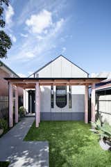 The original home featured a "bull-nose" veranda. This has been reinterpreted as a simple structure that allows the garden to continue and more light to enter the front bedroom.