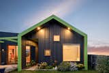 A green wraparound fascia and staggered windows provide a quirky welcome and set the tone for The FUN House. 