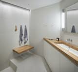 The master bathroom retains its original configuration, including a sunken shower.