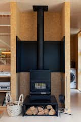 The solid ceramic fireplace in the downstairs living room can hold heat overnight.