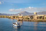 2,629 people live in a group on 91 floating islands, and individual islands are inhabited by up to 12 families. While they live isolated on Lake Titicaca, the Uros islands are located only three miles from the small port city of Puno in Peru.