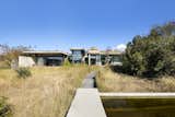 A timber boardwalk through the veld grass leads to a 15-meter, reed-filtration lap pool.&nbsp;