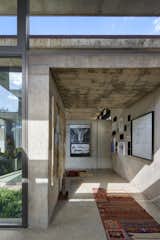 House V by Daffonchio Architects concrete hallway and gallery wall