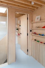 Hallway storage at Two and a Half Storey House by Bradley Van Der Straeten Architects.