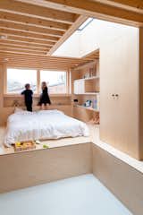 With their plans to add an additional floor thwarted, BVDS Architects fit a new loft bedroom into a half-height space that feels surprisingly open.&nbsp;The consistent use of plywood throughout makes the complex space feel more cohesive and expansive.
