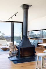Living room with fireplace at Kangaroobie by Modscape.