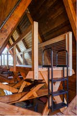 The timber mezzanine structure was designed to match the existing structure of the home. Exposed Douglas fir dimensional lumber was used throughout. It was stained with a particular water-based Shaker stain mix to imbue the wood with a warm hue and define it from the original house elements.