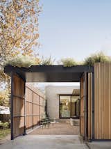 Entrance courtyard of Hemlock Ave. House by Chioco Design.