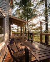 The deck, which overlooks the uninterrupted forest, has been left uncovered so the inside of the house receives ample natural light throughout the year. 