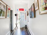 "We did try to retain and celebrate features of the original house we discovered," says Joe. Features such as the original tiles and stained glass in the entrance hallway were retained, and pressed-metal ceilings, fireplaces, and original cedar skirts and architraves were all reworked and reinstalled.