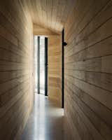 The client desired a home with no use of plasterboard or paint. As a result, the interior walls are clad in timber. "This ties in very strongly with the idea of the retreat," says Shields. "It creates a space that feels more like a cabin, different from the home environment."