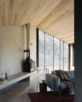 At the far end of the "living shed" is a fireplace and concrete bench, which offers a contemplative space for reading and watching the bushland through the windows.&nbsp;