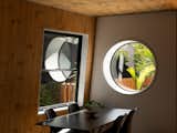 The round "Scott Window" is a reference to New Zealand architect John Scott. "His work is influential to TOA as a studio," says Craig. "The window links the main space of the house to the outdoor space."