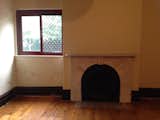 Before: Like the lounge room, the dining room before the renovation was relatively dark with small windows.  Photo 14 of 37 in Before & After: A Blighted Boarding House in Sydney Is Now an Adaptable Courtyard Home