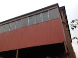Before: A view of the boxed in balcony from the street.  Photo 28 of 37 in Before & After: A Blighted Boarding House in Sydney Is Now an Adaptable Courtyard Home
