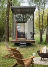 The outdoor deck seamlessly extends out from the living room, allowing residents to expand the living space outdoors in warmer months. The canopy protects the deck from sun and rain. 