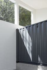 "I love the heavy weight of the dark grey container in the bright, white space," says the architect.&nbsp;&nbsp;