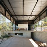 "The garage and the verandas play an important role in the relationship between external and interior spaces," says architect Gaú Manzi. "From the garage, one can see the landscape through the house itself and into the living room, kitchen ,and library, as the construction is rather transparent."&nbsp;