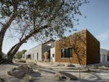 The corrugated steel siding and roof reflect the radiant heat from the desert sun.