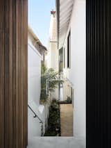 Entry courtyard of Bring to Light Terrace House by Stafford Architecture.