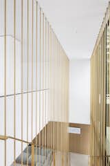 The brass staircase was one of the costliest elements of the build. "It was worth investing in [because]&nbsp; it contributes to defining the ambiance of the house in its two most important rooms—the living and dining [areas]," Chevalier states.&nbsp;