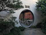In Suzhou, China, the UNESCO-listed Master of the Nets garden is home to the Moon Gate, which also exhibits a circular motif. "The symbolic borrowing of the moon as a tool for shakkei can be found in both China and Japan," says Walker. "At this 12th-century garden, the Moon Gate offers a view of some carefully clipped bonsai trees, which reference the wild landscape of China."