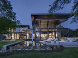American architect Allison Ewing utilized cantilevered rooflines and terraces to emphasize the beauty of this family residence’s site in Virginia Beach, Virginia. "The building forms, detailing, and material selections all draw on the concept of shakkei," Ewing says.&nbsp;