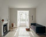 Living room of Concrete Plinth House by DGN Studio