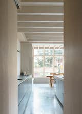 Kitchen of Concrete Plinth House by DGN Studio