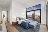 The bedrooms of the Icon model at Benloch Ranch offer plenty of space, en suites, and walk-in wardrobes, as well as access directly to a private deck through large glass doors.  Photo 9 of 15 in You Can Buy a Vacation Home Using Bitcoin at This New Luxe Resort in Utah