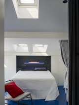 A Cramped Attic Apartment in Madrid Is Revived With Mirrored Walls and a Blue Floor - Photo 4 of 15 - 