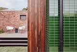 The Shiny Tile Wrapping This Melbourne Home Reflects the Greenery Around It - Photo 11 of 12 - 