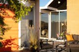 The backyard features an outdoor sitting area for enjoying California’s famously sunny weather.
