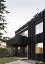 In Sweden, Two Matching Homes Nest Under One Black Gable Roof - Photo 11 of 18 - 