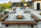 Combine native plants with rockscapes to create gardens that don’t need excessive irrigation. Here, Techo-Bloc’s Industria 600 series slab in Greyed Nickel was imaginatively used to create contrast between the more organic stones and rocks, as well as functional walkways for seating and a fire pit.