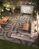 Make the most of warm, summer nights with a glitzy patio that doubles as the stage for an outdoor cinema. Maximalism is a big trend in 2022—think graphic black and white patterns with bronze or gold highlights. The bold pattern on this patio has been crafted using Techo-Bloc’s Squadra paver in Shale Grey and Onyx Black. The small three-by-three square cobblestones have an aged finish and are ideal for creating mosaics at ground level.