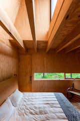 Bedroom of Rain Harvest Home by Robert Hutchison Architecture & JSa