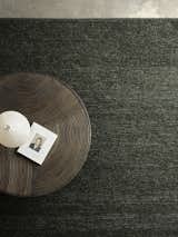 Here, the raw texture of the Panama rug (in Kale) contrasts with smooth concrete flooring and intricately detailed timber furniture to create a space rich in personality.  Photo 4 of 8 in Invite Elements of Nature Into Your Home With Armadillo’s New Rugs