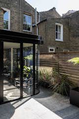 The garden was previously occupied by over-scaled, built-in planters and benches that made it feel much smaller than it actually is. Likewise, the rear of the house was dark and cramped, making it unsuitable for entertaining and relaxed living.