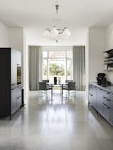 A Vipp V1 kitchen complements the period details found throughout the home. “It doesn’t steal the glory from the home’s decor,” says Thomas. “The same can be said for my choice of furniture, lamps, art and ceramics, which I tried to keep fairly subdued.”