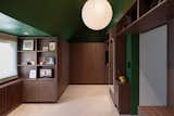 For 2023, Ritz sees a rise in dramatic, moody interiors—such as this walk-in wardrobe in London, which is defined by dark millwork and walls painted in Greenfield by Sherman Williams.