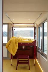 The control panel can be almost entirely concealed by a bed that can flip down to float above the technical instruments. "Marianne is extremely happy with this transformable approach, achieving a calmer sense of home by hiding the more technical elements of the boat," says Lenhardt.