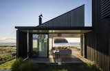 The 1970s houses of Whangamatā were the design source for this new beach bach—the simple gables, lean-tos, decks and yards. "The clients and I walked the neighborhood to have a look at the existing character," says architect Paul Clarke. "They wanted to build sympathetically in the form and size of the building, so we’ve reused elements we know well, but combined them in a new way to put together something different."