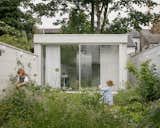 Backyard Studio of White Patio House by Pashenko Works